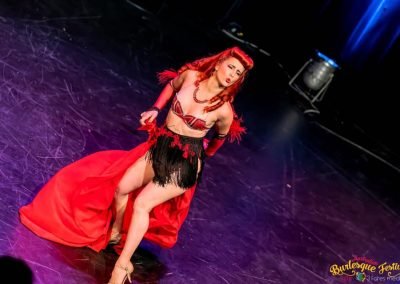 Live shot of Burlesque Dancer Kelly Ann Doll performing live in front of an audience for Australian Burlesque Festival